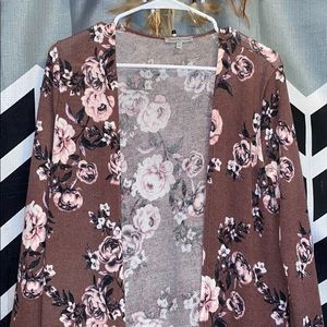 This never worn beautiful cardigan.